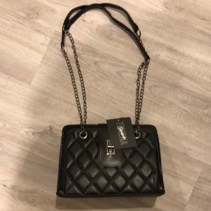 Black purse with tags